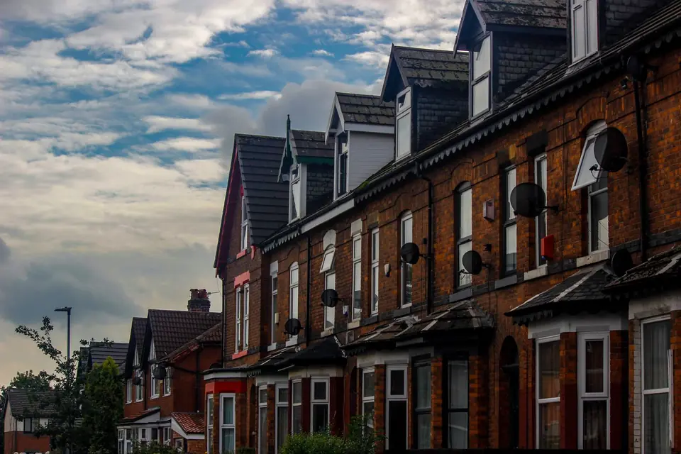 A brick end terrace house at the end of a row, with its side gable wall exposed